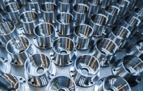 Stack of CNC-turned aluminium flanges – series production of precision components