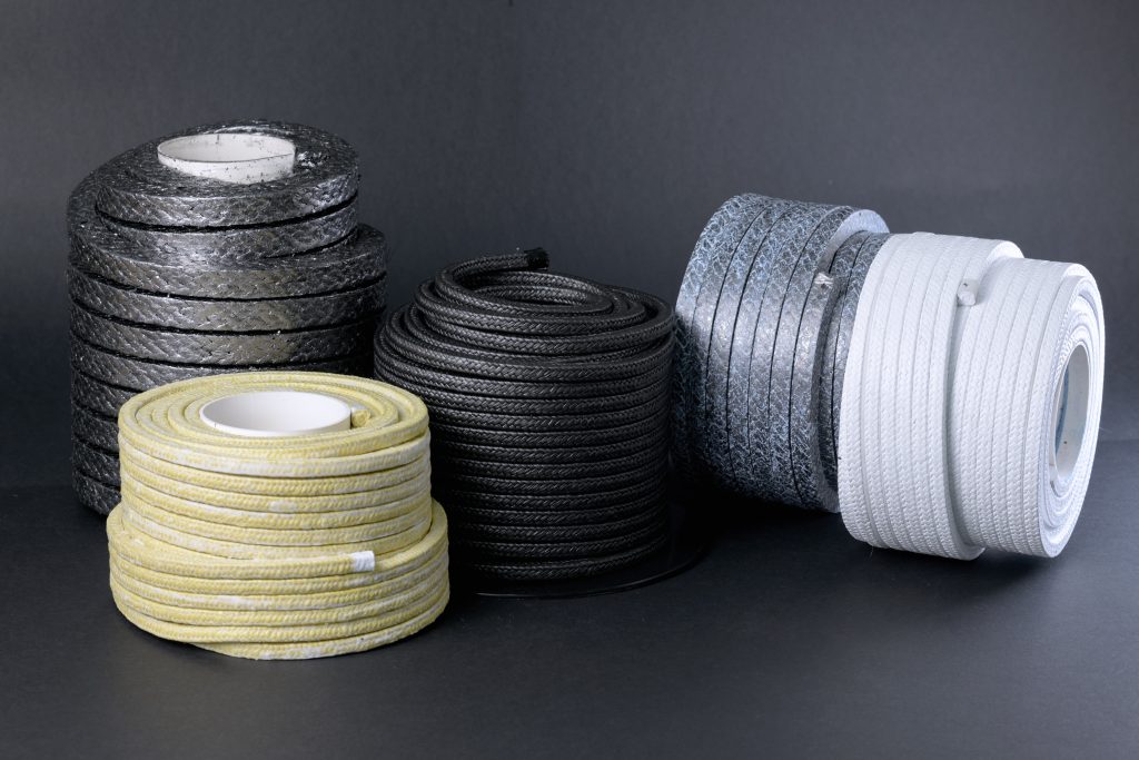 Four coils of braided packing on spools - aramid, Kevlar, PTFE and silver graphite in wholesale quantities