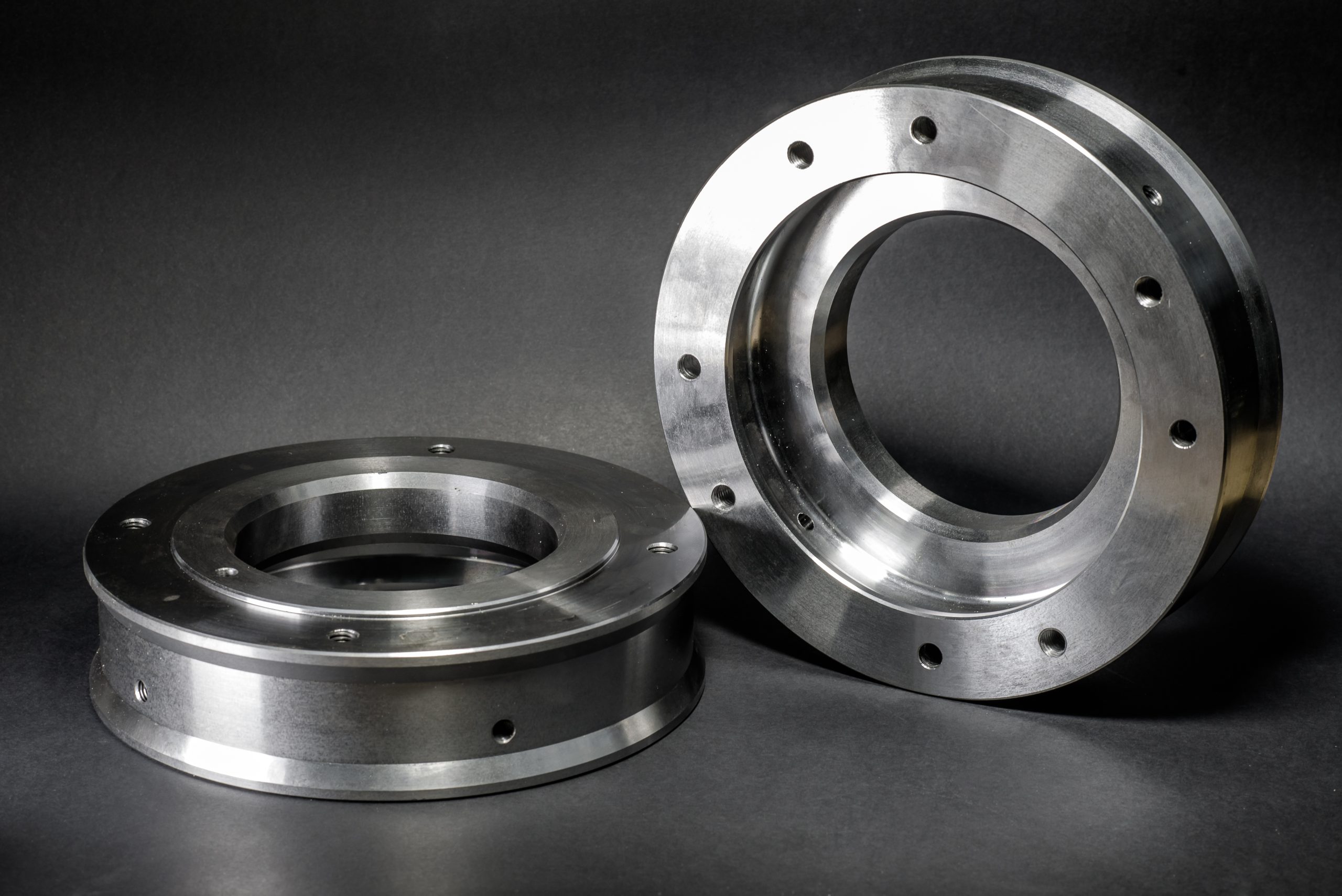 Two turned stainless steel flanges with mounting holes - precision CNC machining